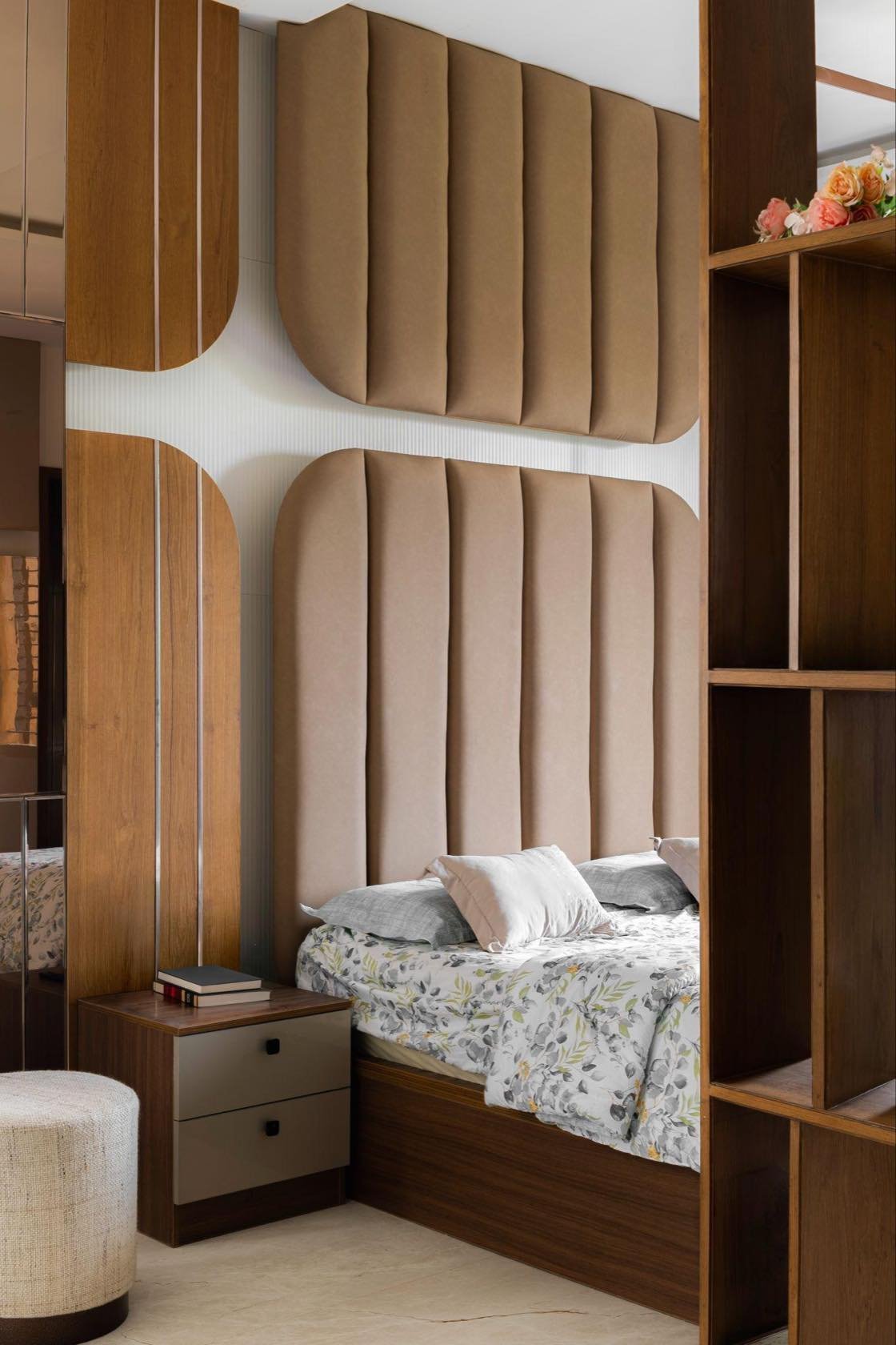 Bedroom with arched fluted headboard and open shelving