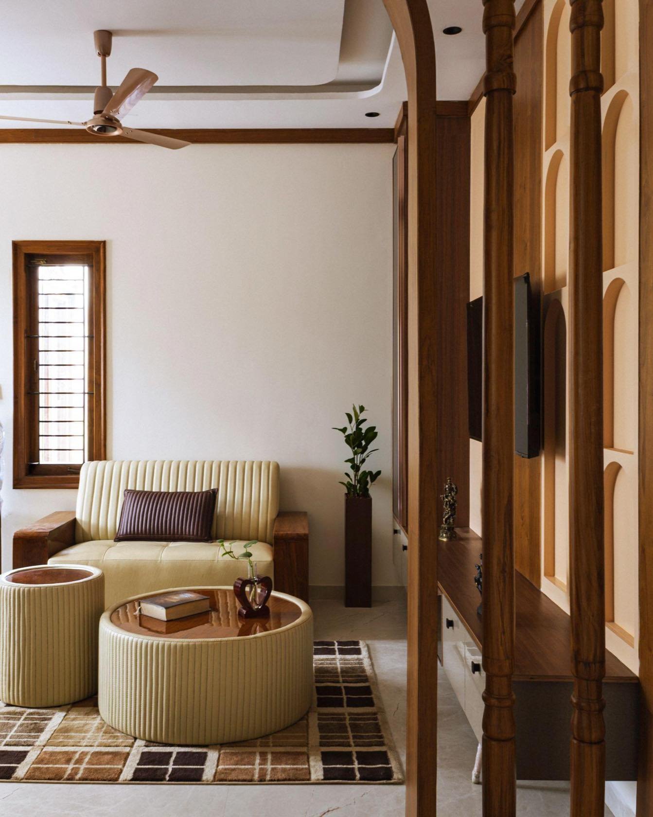Living seating with fluted poufs and timber screen