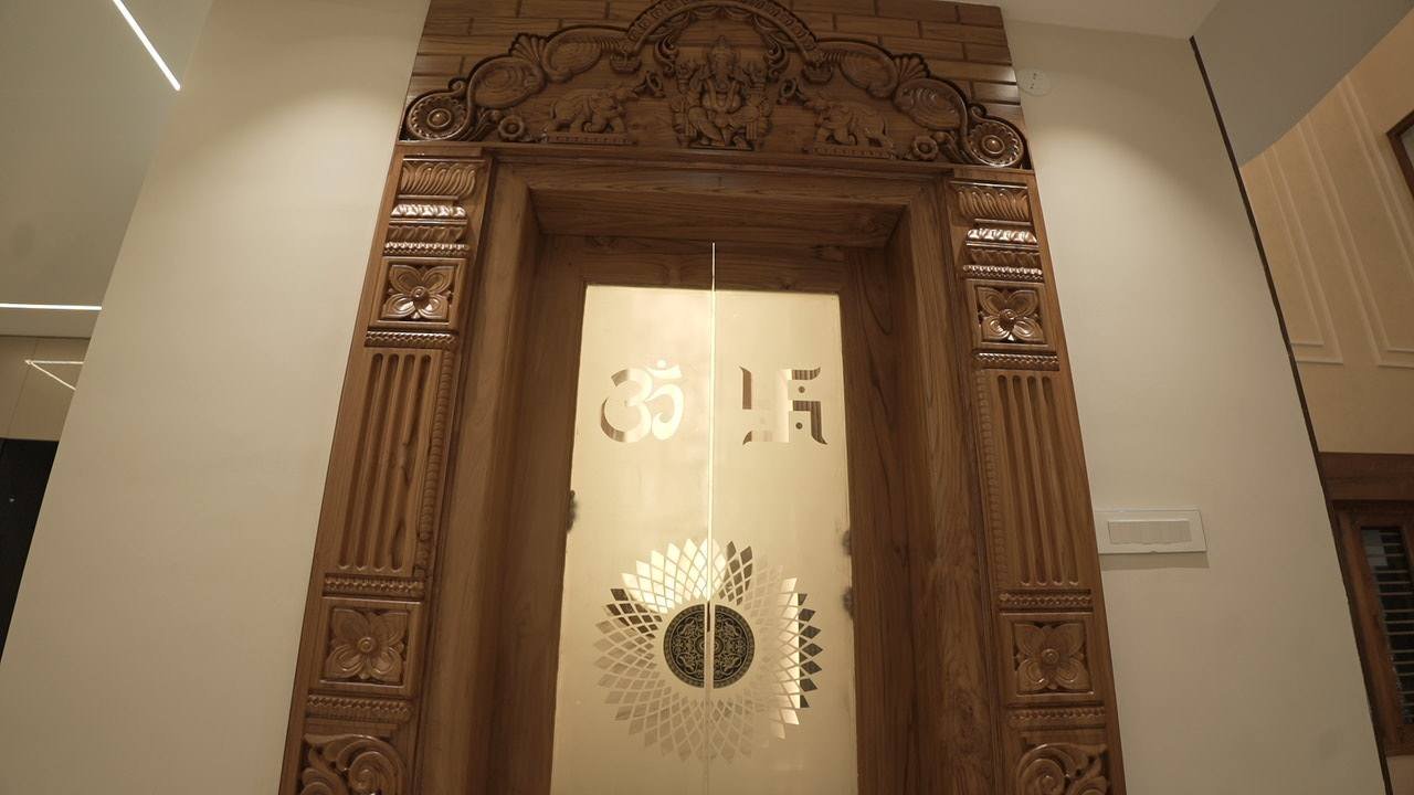 Carved teak pooja doorway with etched glass