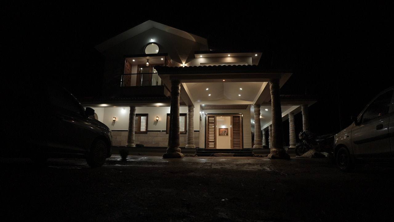 The house lit up at night