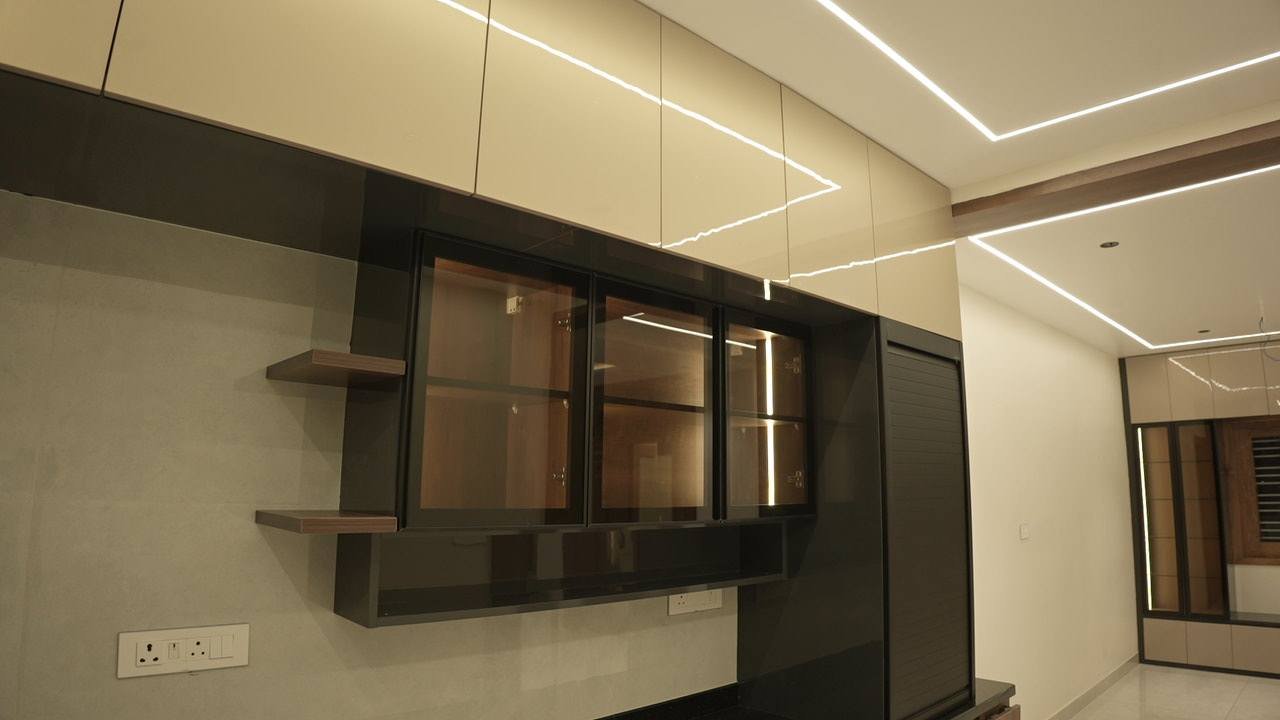 Kitchen cabinetry with smoked-glass shutters and open shelves